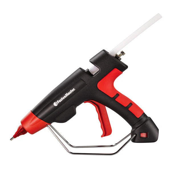 A red and black Fasten Master hot glue gun with a metal stand, shown on a solid white background.